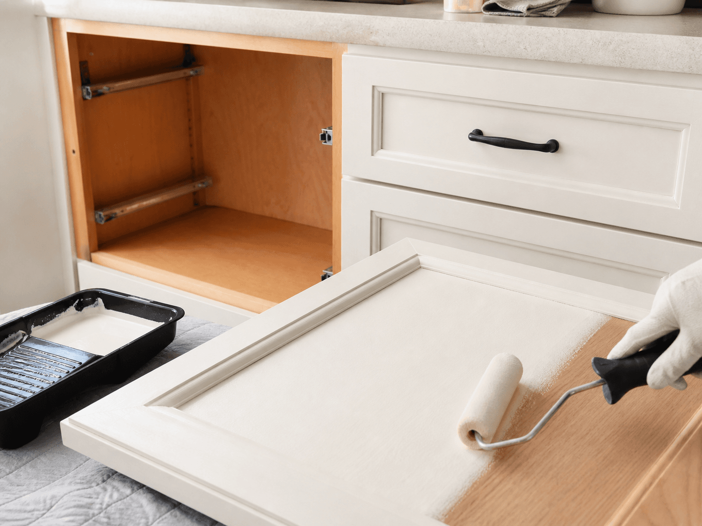 Cabinet door being professionally prepared and refinished